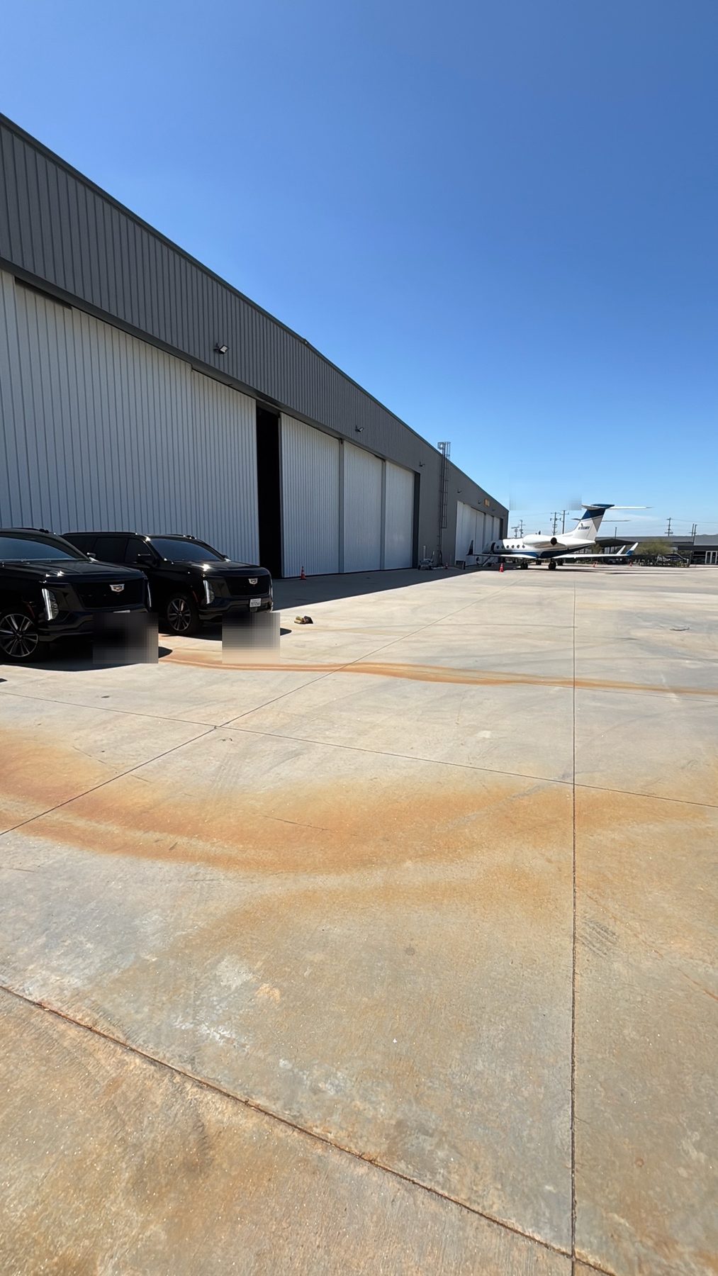 Secure vehicles positioned near a private aircraft ramp