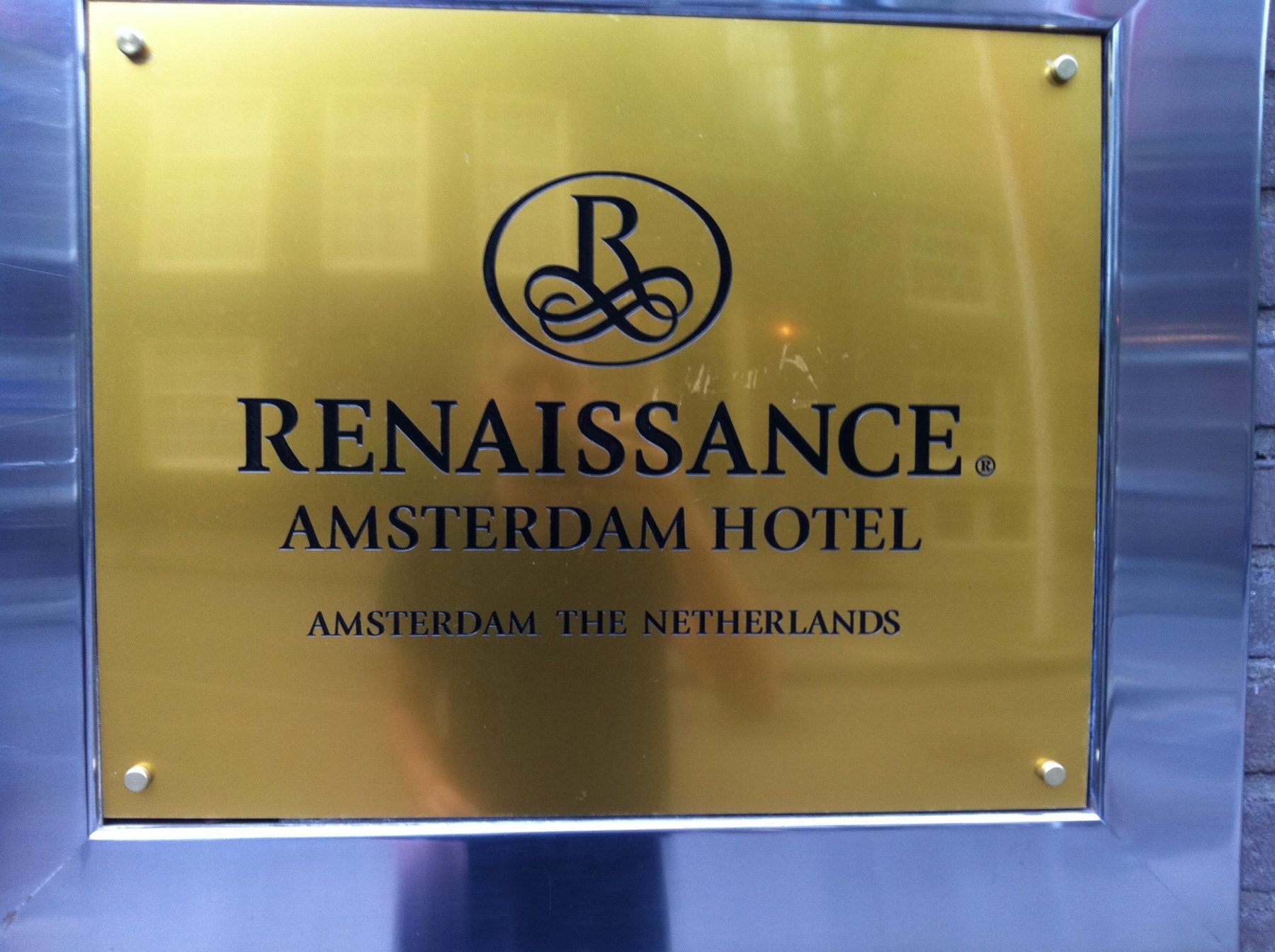 Hotel sign blurred for privacy during travel planning