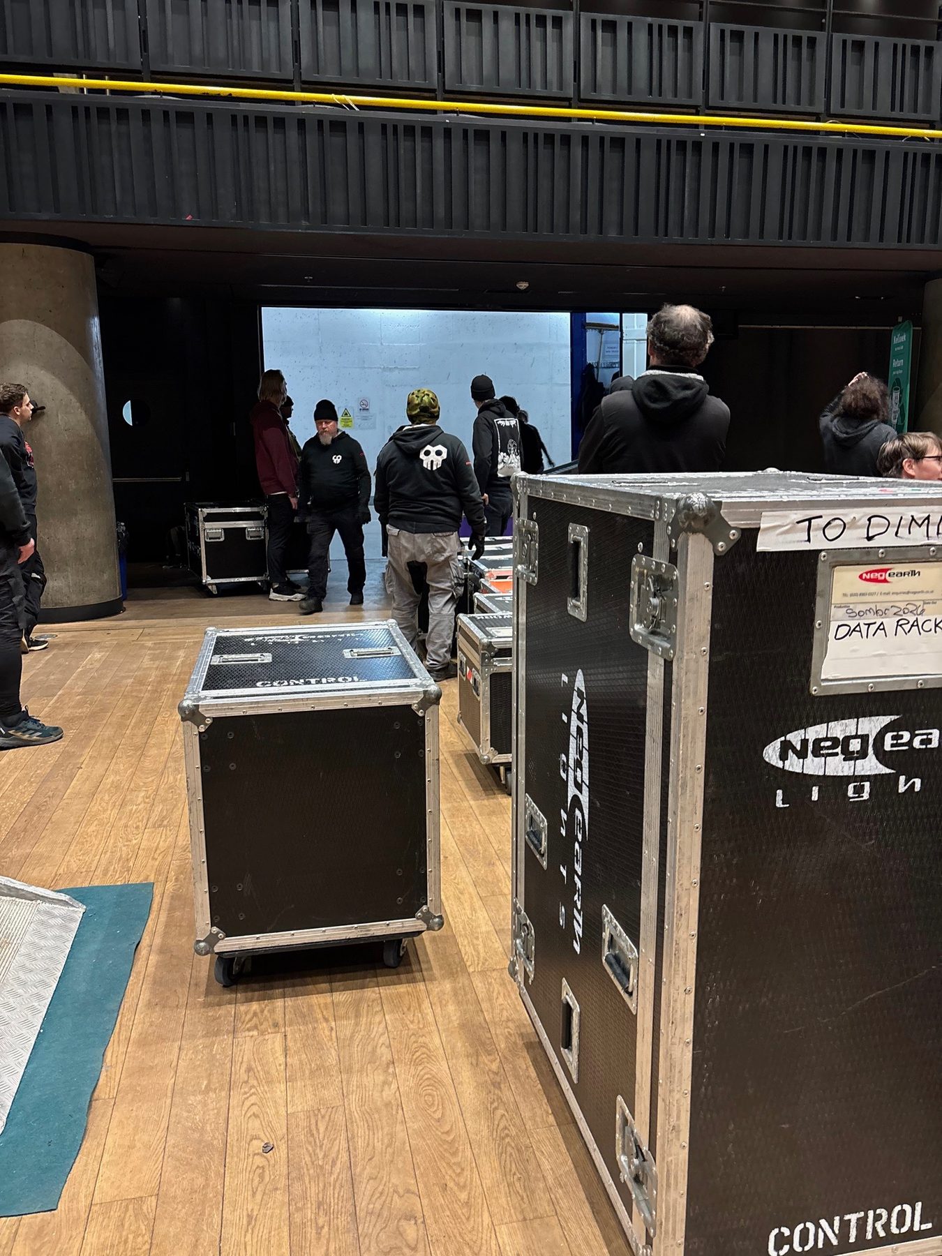 Backstage road case and personnel movement at a venue