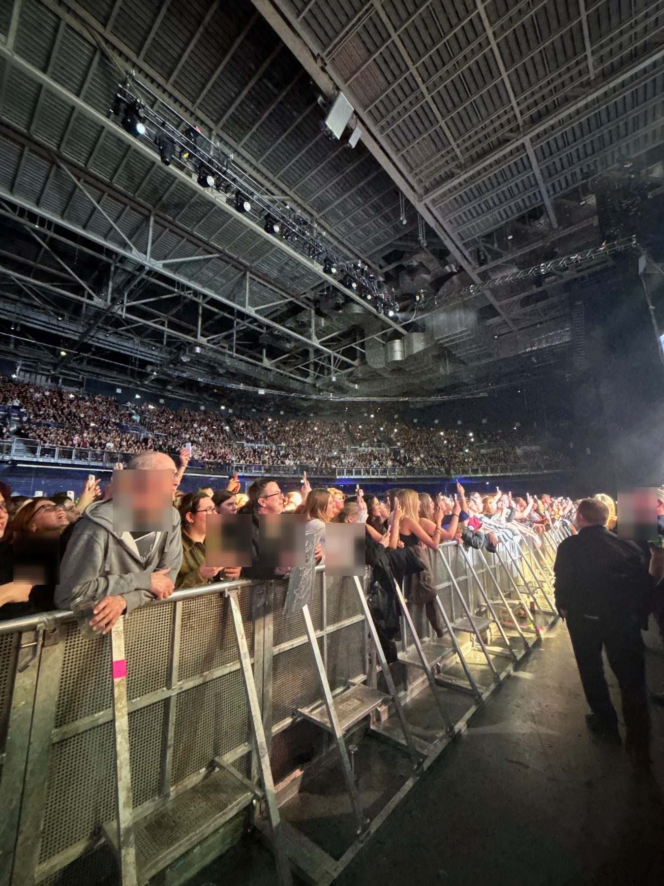 Security line beside an arena barricade